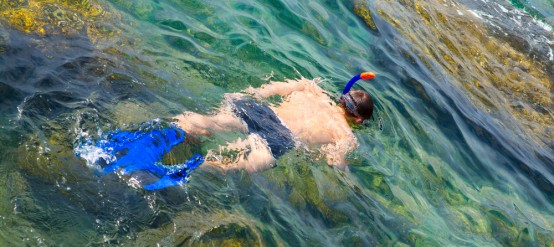 Man snorkeling in blue sea of Cancun